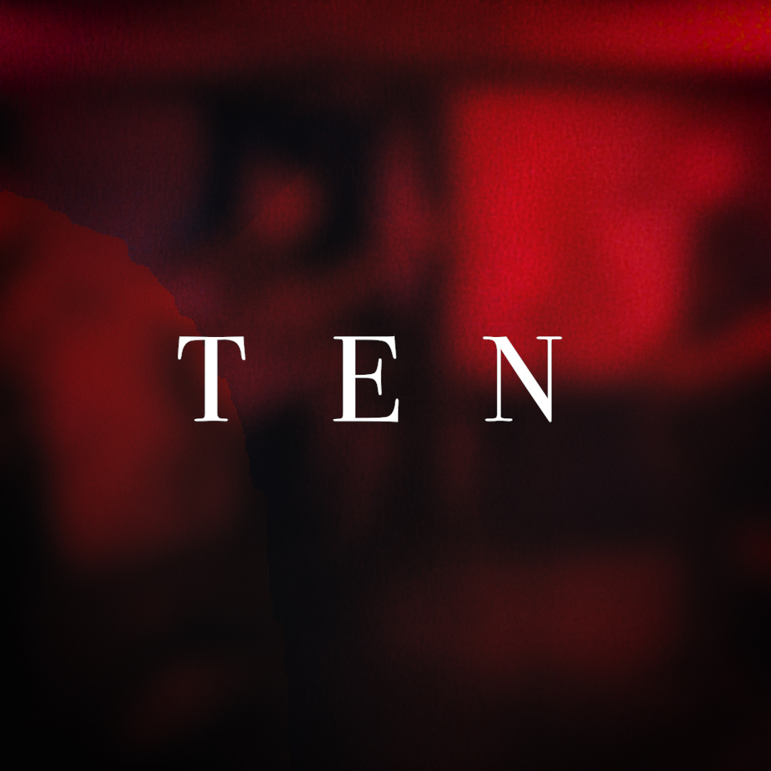 Ten on a red blurred background