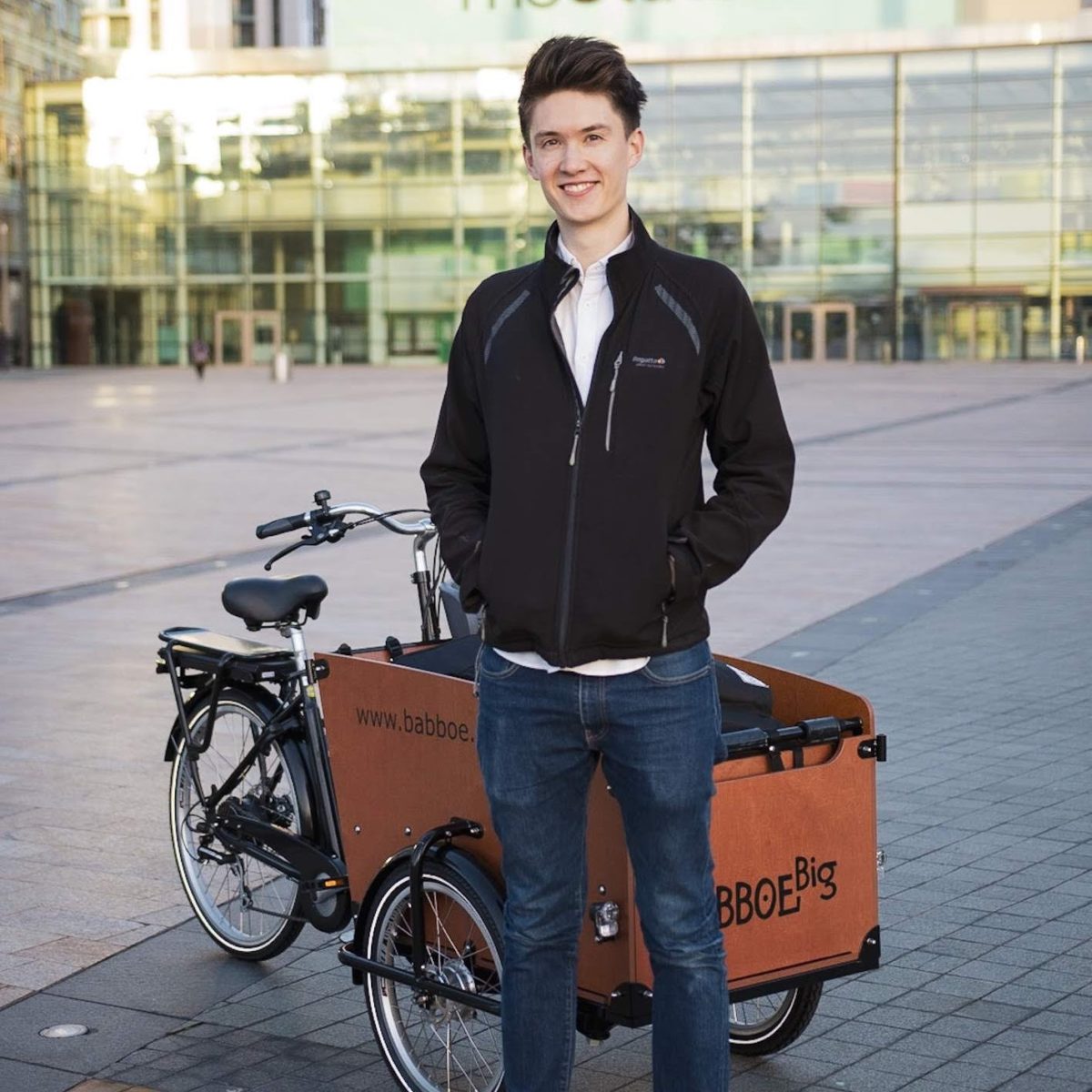 Ben Horrigan with Studio 91's cargo bike, which is full of video production equipment.