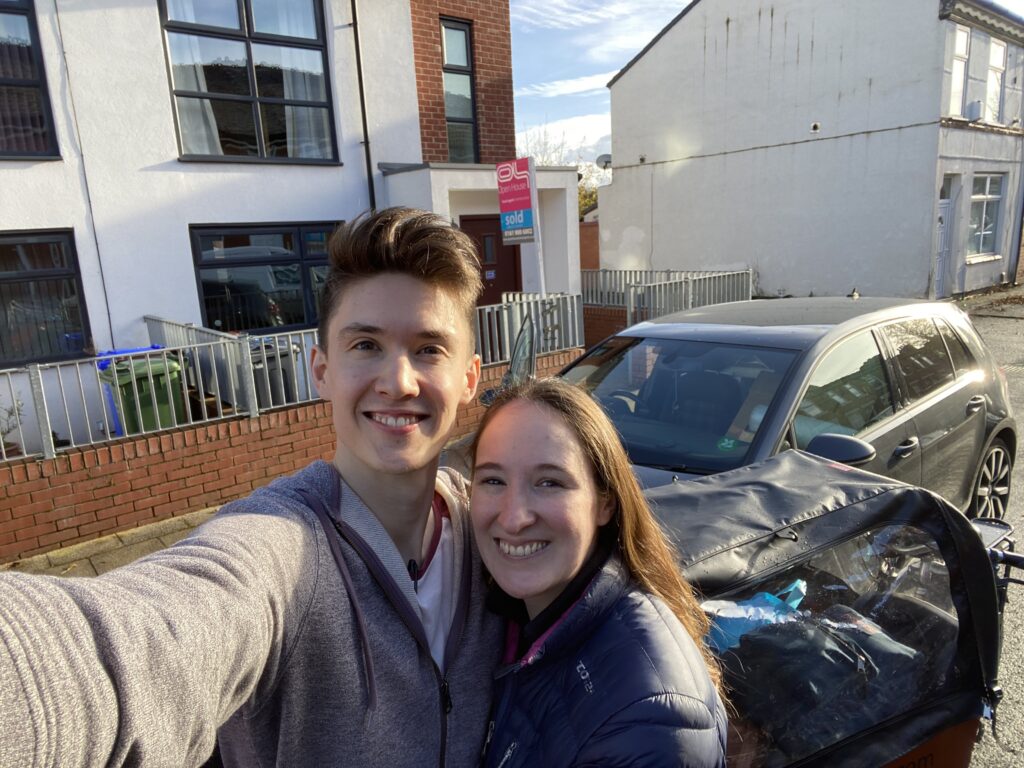 Ben and Ellie Horrigan outside their old house in Manchester before moving to Cheadle Hulme, Stockport