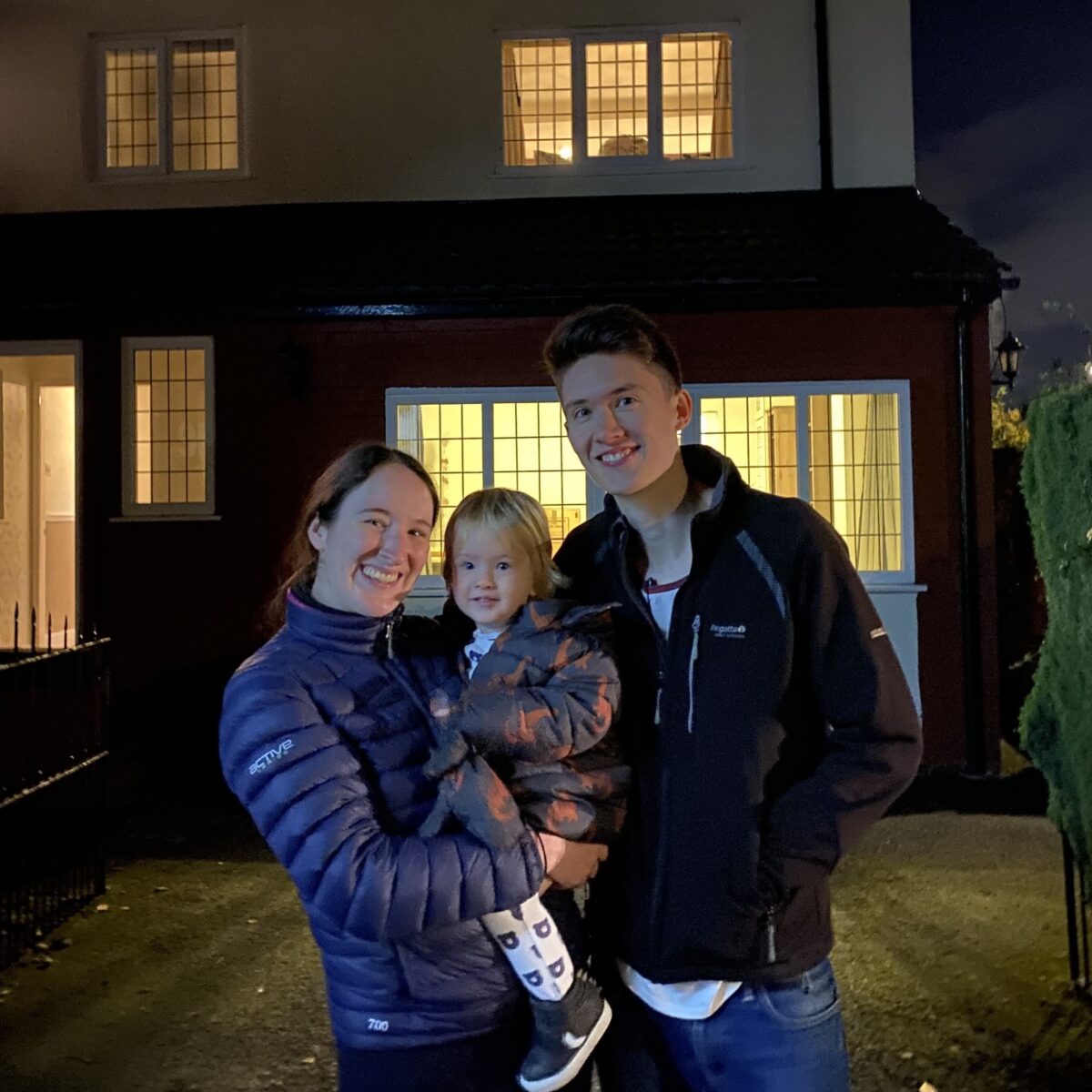 Ben and Ellie Horrigan in front of their house