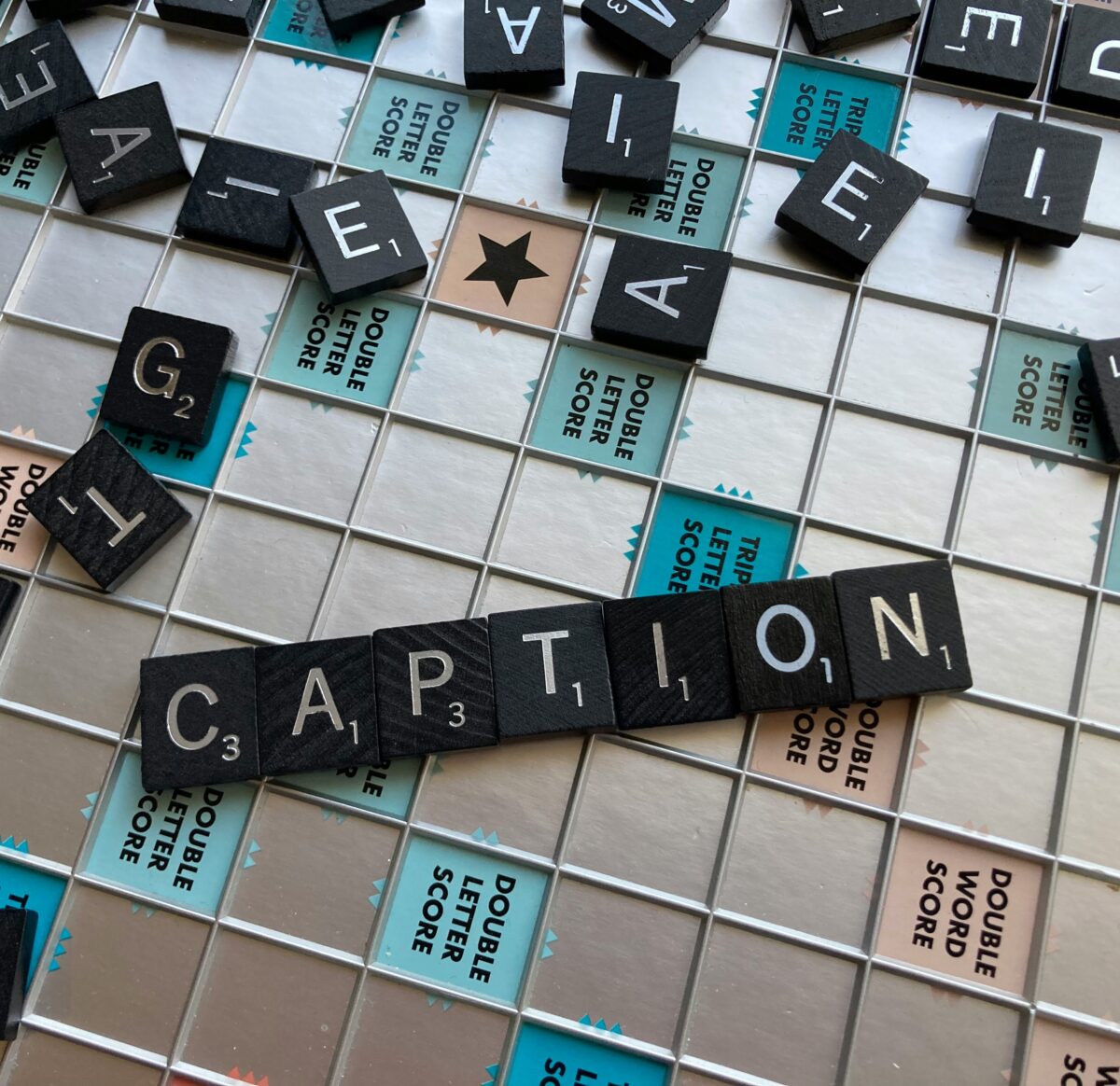 A close up of a scrabble tile wall with words written on it